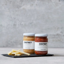 Load image into Gallery viewer, chutney in glass jar on a serving plate with cheese
