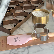 Load image into Gallery viewer, marble kitchen counter top with Ra Dunn pink spatula and cookie cutter double hearts

