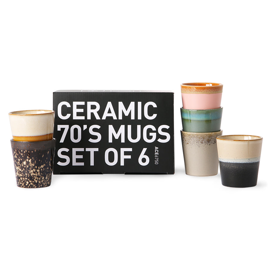 ceramic coffee cups in different colors with a black box